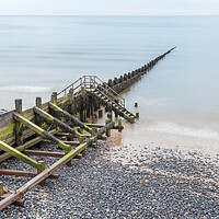 Buy canvas prints of Wooden groyne stretching into the sea by Jason Wells