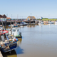 Buy canvas prints of Fishing boats line the quay at Wells next the Sea by Jason Wells