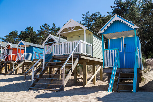 Colourful beach huts at Wells next the Sea Picture Board by Jason Wells