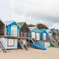 Buy canvas prints of Abersoch beach huts lined up by Jason Wells