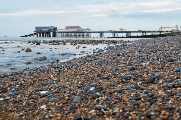 Cromer Pier seen over the shingle beach Picture Board by Jason Wells