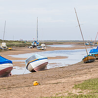 Buy canvas prints of Boats beached at Blakeney by Jason Wells