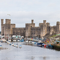 Buy canvas prints of Caernarfon waterfront and castle by Jason Wells