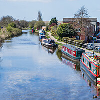 Buy canvas prints of Narrow boats lined up at Burscough by Jason Wells