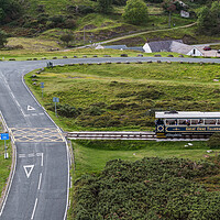 Buy canvas prints of Tram on the Great Orme crossing the road by Jason Wells