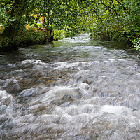 Buy canvas prints of Water flowing towards Llyn Padarn by Jason Wells
