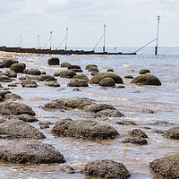 Buy canvas prints of Waves lap up against the rock pools at Hunstanton beach by Jason Wells