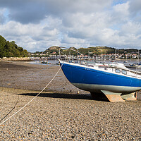 Buy canvas prints of Boat beached at low tide by Jason Wells