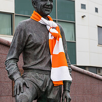 Buy canvas prints of Jimmy Armfield statue wrapped in an orange and white scarf by Jason Wells