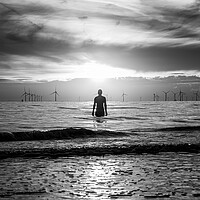 Buy canvas prints of Silhouette of an Iron Man at sunset by Jason Wells