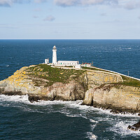 Buy canvas prints of Waves crash around South Stack Lighthouse by Jason Wells