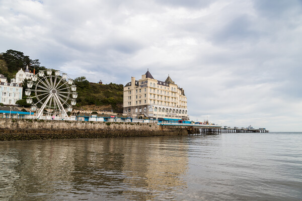 Llandudno Pier reflecting in the water Picture Board by Jason Wells