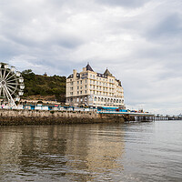 Buy canvas prints of Llandudno Pier reflecting in the water by Jason Wells