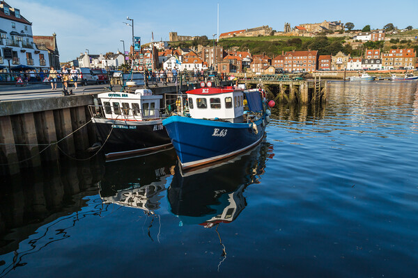 Fishing boats in Whitby harbour Picture Board by Jason Wells