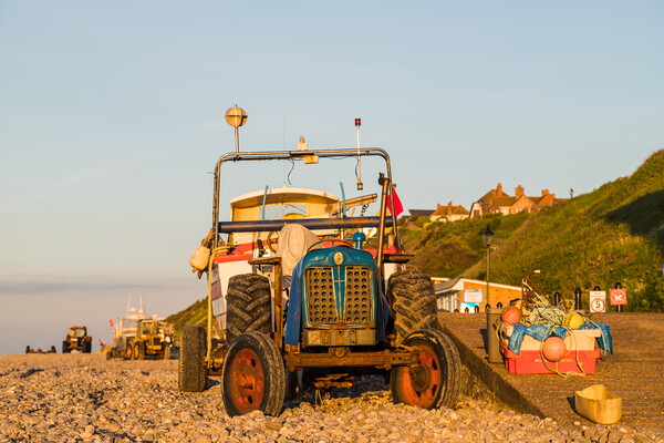 Tractors and boats at sunset Picture Board by Jason Wells