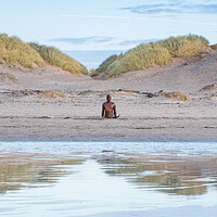 Buy canvas prints of Iron Man reflecting in the wet sand by Jason Wells