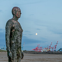 Buy canvas prints of Moon behind an Iron Man by Jason Wells