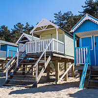 Buy canvas prints of Colourful beach huts at Wells next the Sea by Jason Wells