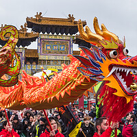 Buy canvas prints of Dragon Dance in front of the arch by Jason Wells