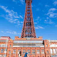 Buy canvas prints of A family pass Blackpool Tower by Jason Wells