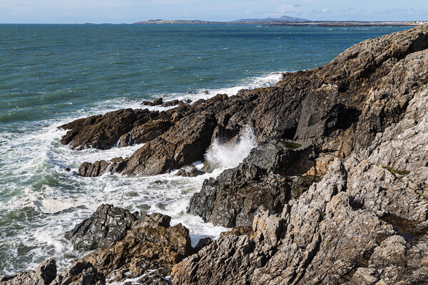 Rocky headland between Porth Trecastell and Porth Nobla Picture Board by Jason Wells
