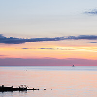 Buy canvas prints of Groyne silhouettes at Cromer by Jason Wells