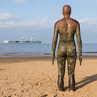 Buy canvas prints of Iron Man looks out towards HMS Queen Elizabeth by Jason Wells