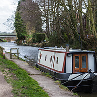 Buy canvas prints of Small narrow boat on the canal by Jason Wells