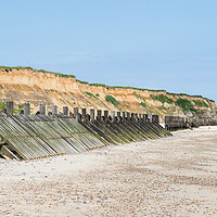 Buy canvas prints of Happisburgh revetments on the beach by Jason Wells