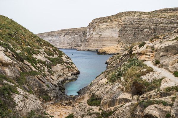 Xlendi Bay surrounded by cliffs Picture Board by Jason Wells