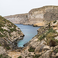 Buy canvas prints of Xlendi Bay surrounded by cliffs by Jason Wells