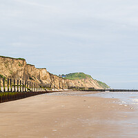 Buy canvas prints of Sea defences at West Runton curve round the coast by Jason Wells