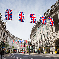 Buy canvas prints of Piccadily Circus under Union Jacks by Jason Wells