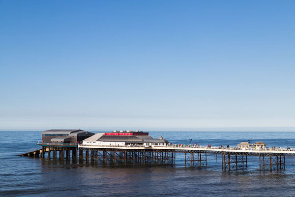 Cromer pier under a blue sky Picture Board by Jason Wells