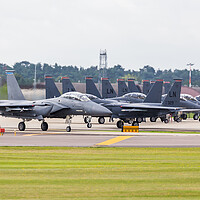 Buy canvas prints of F-15E Strike Eagles prepare to depart by Jason Wells