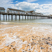 Buy canvas prints of Waves wash back into the sea under Southwold Pier by Jason Wells