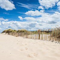 Buy canvas prints of Holkham beach under a blue sky by Jason Wells