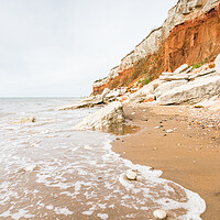 Buy canvas prints of Waves lap up on Hunstanton beach by Jason Wells