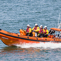 Buy canvas prints of RNLI Life boat racing into the sea by Jason Wells