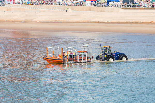 Life boat being launched from its semi submersible tractor Picture Board by Jason Wells