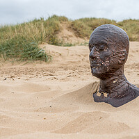 Buy canvas prints of Iron Man up to his neck in sand by Jason Wells