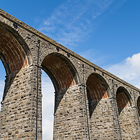 Buy canvas prints of Ribblehead Viaduct under a blue sky by Jason Wells