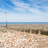Buy canvas prints of Red and white rocks on Hunstanton beach by Jason Wells