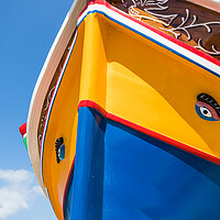 Buy canvas prints of Luzzu boat under a blue sky by Jason Wells