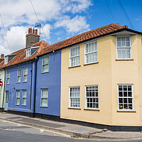Buy canvas prints of Colourful row of houses in Southwold by Jason Wells