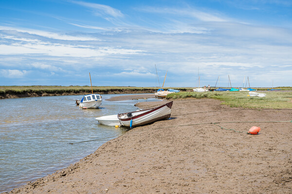 Boats along a channel at Blakeney Picture Board by Jason Wells
