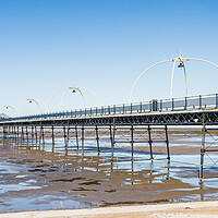 Buy canvas prints of Southport Pier reflecting in pools of water by Jason Wells