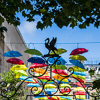 Buy canvas prints of Silhouette of a Liverbird in front of the floating umbrellas by Jason Wells