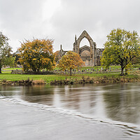 Buy canvas prints of Bolton Abbey over submerged stepping stones by Jason Wells