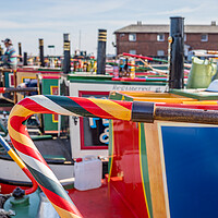 Buy canvas prints of Colourful steering tillers on narrow boats by Jason Wells